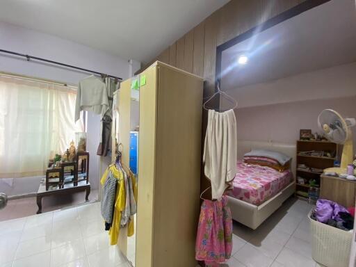 Spacious bedroom with wardrobe and bed