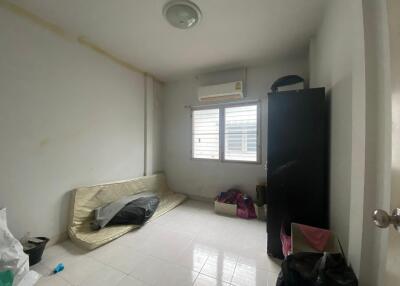 Small unfurnished bedroom with air conditioning