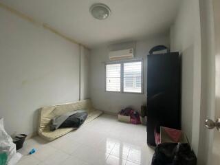 Small unfurnished bedroom with air conditioning