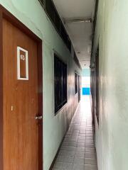 Narrow hallway with door number 65