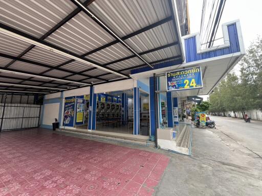 Exterior view of a laundromat with parking space