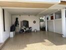 Covered garage with tiled floor