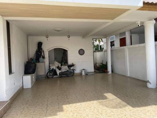 Covered garage with tiled floor