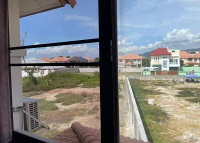 View from a window overlooking a neighborhood