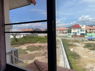 View from a window overlooking a neighborhood