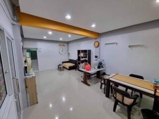 Spacious living and dining area with ample seating and study space