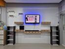 Modern living room entertainment wall with mounted TV and shelves