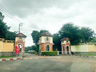 Gated property entrance with guard houses