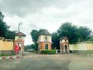 Gated property entrance with guard houses