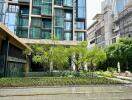 Modern residential building exterior with landscaped garden