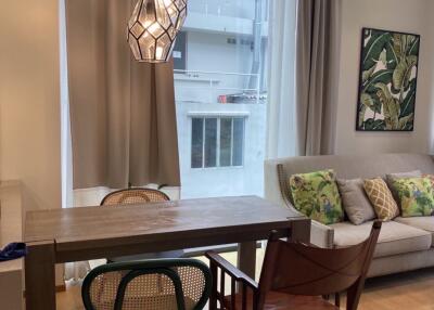 Modern living room with dining area and stylish lighting