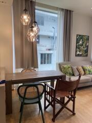 Modern living room with dining area and stylish lighting