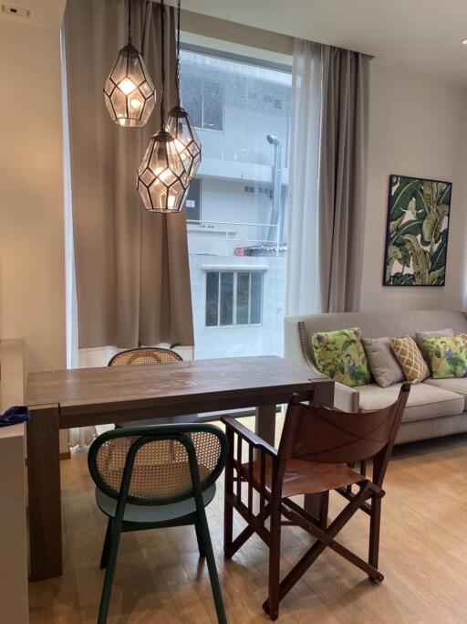 Modern living room with dining area and stylish lighting