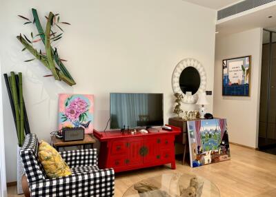 Well-decorated living room with unique artwork and modern amenities