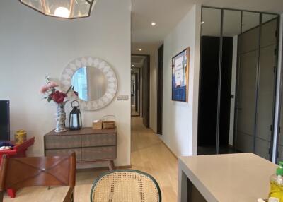 Modern living and dining area with hallway