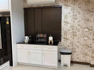 Modern kitchen with white cabinetry and appliances