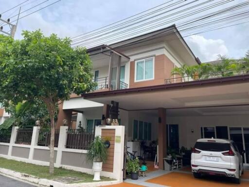 Two-story house with a carport