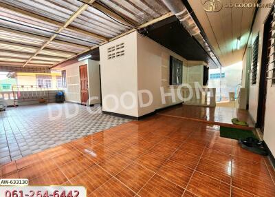 Covered outdoor area with multiple entrances and tiled floor