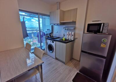 Modern kitchen with dining table and appliances