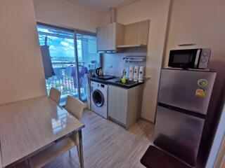 Modern kitchen with dining table and appliances