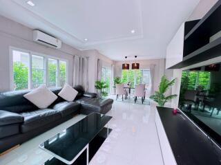 Spacious and modern living room with dining area