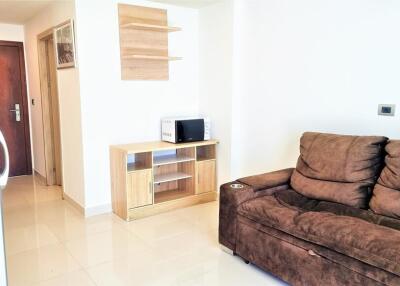 Modern living room with brown sofa and wooden cabinet