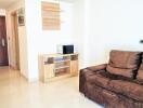 Modern living room with brown sofa and wooden cabinet