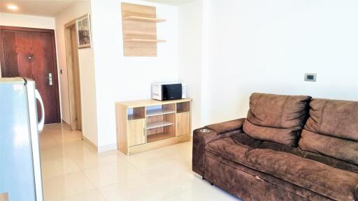 Modern living room with brown sofa and wooden cabinet