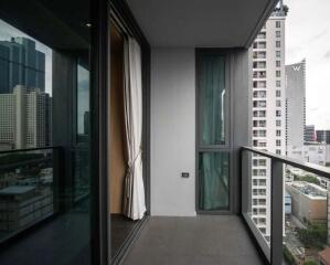 Modern high-rise apartment balcony with city view