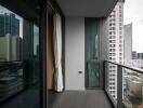 Modern high-rise apartment balcony with city view