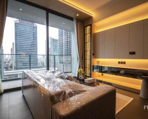 Modern living room with a large window and city view