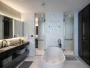 Modern bathroom with a large bathtub, double sinks, and marble finishes