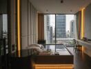 Modern bedroom with bed, desk, and panoramic window view of cityscape