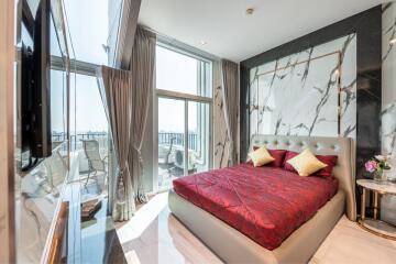 Luxurious bedroom with large windows and balcony access