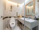 Modern bathroom with marble finishes and a large mirror