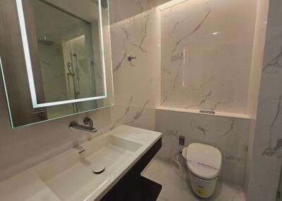 Modern bathroom with illuminated mirror and rainfall shower