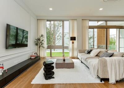 Modern living room with large windows and contemporary furniture