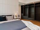 Spacious bedroom with modern design and open closet