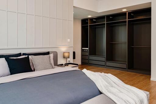 Spacious bedroom with modern design and open closet