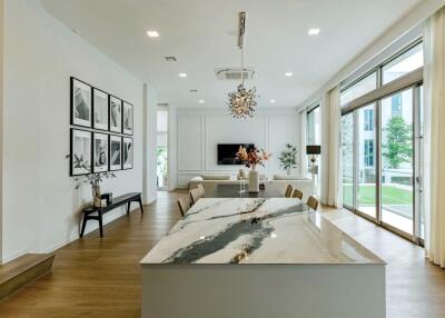 Modern living room with dining area and large windows