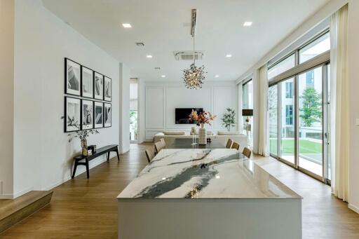 Modern living room with dining area and large windows