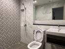 Modern bathroom with tiled shower and large mirror