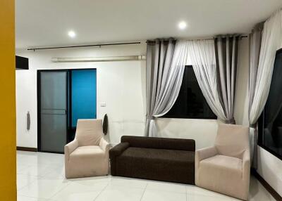 Living room with couches and curtains