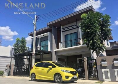 Exterior view of the property with a yellow car parked in front