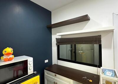 Compact kitchen space with modern amenities