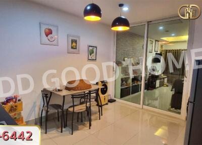 Dining area with glass partition and modern lighting