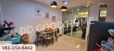 Dining area with glass partition and modern lighting