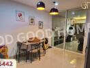 Dining area with glass partition and modern lighting