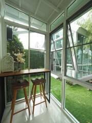 Bright sunroom with large windows