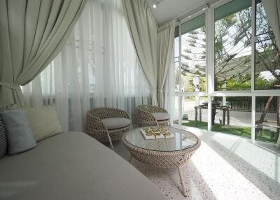 Bright sunroom with cozy seating